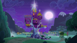 Size: 1280x720 | Tagged: safe, derpibooru import, screencap, to where and back again, background, moon, night, no pony, ponyville, ponyville town hall, scenic ponyville, trixie's wagon, twilight's castle