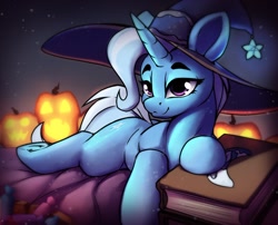Size: 1836x1483 | Tagged: safe, artist:hitbass, derpibooru import, trixie, pony, unicorn, book, candy, female, food, halloween, hat, holiday, jack-o-lantern, lying down, mare, prone, pumpkin, solo, witch hat