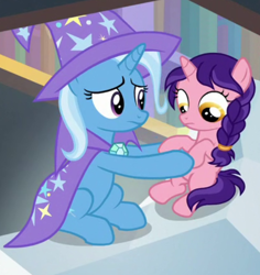 Size: 620x658 | Tagged: safe, derpibooru import, screencap, trixie, pony, unicorn, the ending of the end, cape, clothes, cropped, female, filly, hat, holding a pony, looking down, raspberry dazzle, trixie's cape, trixie's hat