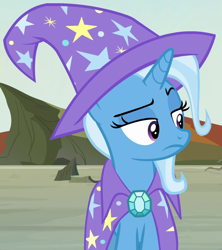 Size: 894x1006 | Tagged: safe, derpibooru import, screencap, trixie, pony, unicorn, to change a changeling, cape, clothes, cropped, hat, trixie is not amused, trixie's cape, trixie's hat, unamused