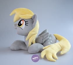 Size: 1400x1260 | Tagged: safe, artist:meplushyou, derpibooru import, derpy hooves, pegasus, pony, irl, lying down, photo, plushie, prone, solo