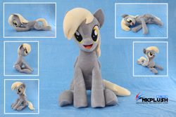 Size: 1280x854 | Tagged: safe, artist:nekokevin, derpy hooves, pegasus, pony, :d, cute, derpabetes, female, irl, looking at you, lying down, mare, obtrusive watermark, open mouth, photo, plushie, prone, side view, sitting, smiling, solo, underhoof, watermark