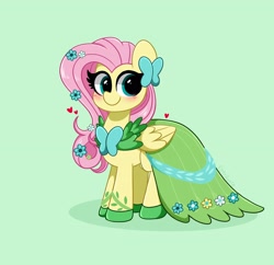 Size: 3200x3100 | Tagged: safe, artist:kittyrosie, derpibooru import, fluttershy, pegasus, pony, blushing, clothes, cute, dress, female, flower, flower in hair, gala dress, green background, green eyes, heart, looking at you, mare, shyabetes, simple background, smiling