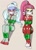 Size: 641x893 | Tagged: safe, artist:nivek15, derpibooru import, edit, sour sweet, sugarcoat, human, equestria girls, annoyed, arm behind back, bondage, bound and gagged, bow, button, christmas, cloth gag, clothes, cropped, cute, duo, female, femsub, footed sleeper, footie pajamas, gag, gift wrapped, glasses, holiday, looking at you, onesie, otn gag, over the nose gag, pajamas, pigtails, ponytail, ribbon, sitting, soursub, submissive, sugarsub, tied up, twintails