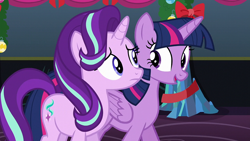 Size: 1920x1080 | Tagged: safe, derpibooru import, screencap, starlight glimmer, twilight sparkle, twilight sparkle (alicorn), alicorn, pony, unicorn, a hearth's warming tail, bow, female, folded wings, frown, looking at each other, mare, wings