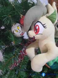 Size: 3024x4032 | Tagged: safe, artist:shappy the lamia, derpibooru import, derpy hooves, oc, oc:shappy, hybrid, lamia, original species, semi-anthro, caption, christmas, christmas lights, christmas tree, holiday, image macro, photo, pine tree, plushie, plushies shy, real life background, realistic, scales, slit eyes, snake eyes, solo, text, tree