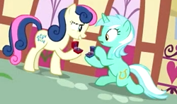 Size: 349x206 | Tagged: safe, screencap, bon bon, lyra heartstrings, sweetie drops, earth pony, pony, unicorn, the big mac question, background characters doing background things, background pony, canon, duo, female, it finally happened, it happened, lesbian, lyrabon, mare, marriage proposal, shipping