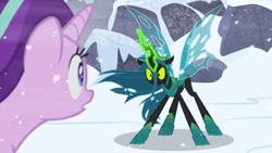 Size: 1366x768 | Tagged: safe, screencap, queen chrysalis, starlight glimmer, changeling, changeling queen, pony, unicorn, the ending of the end, angry, aura, magic, magic aura, outdoors, snow, wind