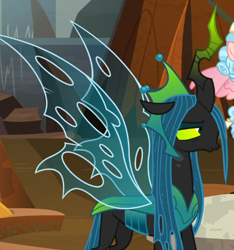 Size: 514x550 | Tagged: safe, screencap, cozy glow, queen chrysalis, changeling, changeling queen, pegasus, pony, the ending of the end, annoyed, cropped, crown, evil lair, female, filly, former queen chrysalis, grogar's lair, horn, jewelry, lair, queen chrysalis is not amused, regalia, solo focus, spread wings, ultimate chrysalis, unamused, wings