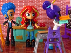 Size: 1520x1140 | Tagged: safe, artist:whatthehell!?, flash sentry, sci-twi, sunset shimmer, twilight sparkle, equestria girls, apple, book, boots, chair, chalkboard, classroom, clothes, desk, doll, equestria girls minis, eqventures of the minis, female, flashimmer, food, guitar, holding hands, irl, jacket, lab coat, male, pair, pants, photo, school, shipping, shoes, straight, toy, tuxedo