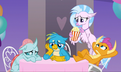 Size: 1606x957 | Tagged: safe, screencap, gallus, ocellus, silverstream, smolder, changedling, changeling, classical hippogriff, dragon, griffon, hippogriff, she's all yak, arm behind head, chair, claws, cropped, crossed legs, curved horn, cute, diaocelles, diastreamies, dragoness, feet on table, female, flapping, flippance, flying, folded wings, food, gallabetes, group, guilty, hand on cheek, horn, horns, jewelry, looking down, looking up, necklace, pearl necklace, popcorn, sad, sad face, sitting, smolderbetes, spread wings, sulking, table, talons, teenaged dragon, teenager, toes, underfoot, wings