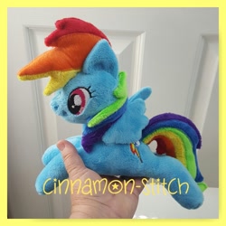 Size: 894x894 | Tagged: safe, artist:cinnamon-stitch, rainbow dash, beanie (plushie), hand, irl, photo, plushie, prone, solo