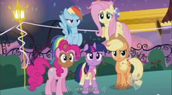 Size: 856x473 | Tagged: safe, derpibooru import, screencap, applejack, fluttershy, pinkie pie, rainbow dash, twilight sparkle, earth pony, pegasus, pony, sweet and elite, birthday dress, bomb, clothes, dress, hub logo, weapon, youtube caption