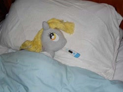 Size: 600x450 | Tagged: safe, artist:eratosofcyrene, derpy hooves, pegasus, pony, bed, ear thermometer, female, irl, mare, photo, pillow, plushie, sick, solo