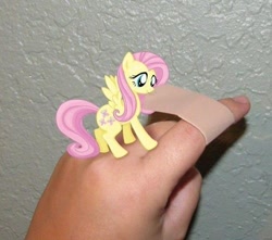 Size: 498x440 | Tagged: safe, fluttershy, human, pony, bandaid, cute, finger, hand, irl, micro, photo, ponies in real life, real life background