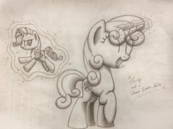 Size: 960x717 | Tagged: safe, artist:squeaky-belle, rarity, sweetie belle, pony, unicorn, duo, giant pony, levitation, macro, magic, monochrome, pencil drawing, size difference, telekinesis, traditional art