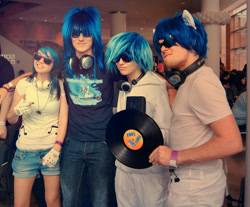 Size: 900x744 | Tagged: safe, artist:caffeinekid11, artist:lauren-campbell, dj pon-3, vinyl scratch, human, b.u.c.k., convention, cosplay, group photo, headphones, irl, irl human, multeity, photo, record, rule 63, wub