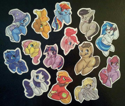 Size: 716x605 | Tagged: safe, applejack, berry punch, berryshine, big macintosh, derpy hooves, dj pon-3, doctor whooves, fluttershy, octavia melody, pinkie pie, princess luna, rainbow dash, rarity, trixie, twilight sparkle, vinyl scratch, alicorn, earth pony, pegasus, pony, unicorn, :p, cute, female, filly, floppy ears, flying, grin, headphones, irl, lidded eyes, magnet, male, mane six, mare, merchandise, mouth hold, one eye closed, photo, prone, raised hoof, shy, silly, sitting, smiling, spread wings, stallion, sunglasses, tongue out, underhoof, wings, wink, woona, younger