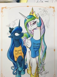 Size: 1536x2048 | Tagged: safe, artist:andypriceart, edit, philomena, princess celestia, princess luna, tiberius, alicorn, pony, andy you magnificent bastard, bedroom eyes, blame my sister, clothes, duo, female, i'm with stupid, looking at you, magic shirt, mare, slingshot, smiling, unamused