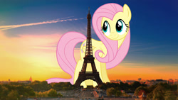 Size: 2560x1440 | Tagged: safe, artist:dashiesparkle, artist:theotterpony, fluttershy, pegasus, pony, eiffel tower, female, france, giant pony, highrise ponies, irl, macro, mare, paris, photo, ponies in real life, solo, story in the source