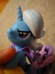 Size: 780x1040 | Tagged: safe, starlight glimmer, trixie, human, pony, unicorn, cape, clothes, eye, eyes, female, figure, finger, irl, macro, mare, official, photo, rocket, thumb, toy, toy interpretation, trixie's rocket