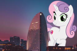 Size: 4189x2793 | Tagged: safe, artist:andoanimalia, artist:jerryakiraclassics19, sweetie belle, pony, unicorn, building, city, female, giant pony, giantess, highrise ponies, irl, looking at you, macro, mare, mega sweetie belle, older, older sweetie belle, photo, ponies in real life, scenery, skyline, smiling, sunset, tree