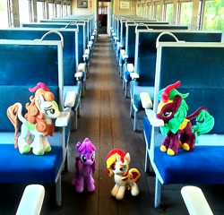 Size: 1502x1440 | Tagged: safe, artist:hihin1993, autumn blaze, berry punch, berryshine, cinder glow, summer flare, sunset shimmer, earth pony, kirin, pony, unicorn, female, irl, japan, lidded eyes, mare, photo, plushie, smiling, train