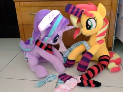 Size: 1024x768 | Tagged: safe, artist:nekokevin, starlight glimmer, sunset shimmer, pony, unicorn, series:nekokevin's glimmy, clothes, cute, duo, female, glimmerbetes, horn sock, irl, looking down, mare, photo, plushie, shimmerbetes, sitting, smiling, socks, striped socks