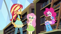 Size: 1100x618 | Tagged: safe, angel bunny, fluttershy, pinkie pie, sunset shimmer, equestria girls, friendship games, book, boots, bracelet, clothes, high heel boots, jacket, jewelry, ladder, leather jacket, library, skirt