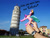 Size: 900x675 | Tagged: safe, artist:shimafox, princess celestia, 12th century, hand, irl, italy, leaning tower of pisa, middle ages, photo, pinklestia, ponies around the world, southern europe, toy, trollestia, watch