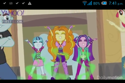 Size: 480x320 | Tagged: safe, screencap, adagio dazzle, apple bloom, aria blaze, snips, sonata dusk, equestria girls, rainbow rocks, amulet, battle of the bands, cellphone, gem, hands up, hypnosis, jewelry, negative energy, pointing, singing, siren gem, the dazzlings