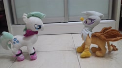 Size: 4128x2322 | Tagged: safe, artist:onlyfactory, derpibooru import, photographer:horsesplease, double diamond, gilda, griffon, pony, bootleg, confrontation, irl, photo, plushie