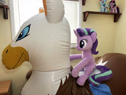 Size: 4032x3024 | Tagged: safe, derpibooru import, gilda, princess celestia, rainbow dash, starlight glimmer, twilight sparkle, griffon, pony, unicorn, series:nekokevin's glimmy, eared griffon, inflatable, inflatable toy, irl, photo, plushie, pool toy, riding, sitting