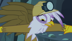 Size: 1280x720 | Tagged: safe, derpibooru import, screencap, gilda, griffon, the lost treasure of griffonstone, female, headlamp, helmet, mining helmet, solo, worried