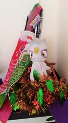 Size: 2240x4032 | Tagged: safe, derpibooru import, photographer:horsesplease, gilda, griffon, flag, malaysia, photo, plushie, shrine, tinsel