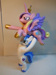 Size: 1536x2048 | Tagged: safe, artist:earthenpony, princess cadance, shining armor, alicorn, pony, unicorn, artisan, colored hooves, custom, epic wife tossing, fastball special, female, hoof hold, irl, jewelry, male, mare, photo, regalia, sculpture, stallion, unshorn fetlocks