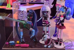 Size: 500x333 | Tagged: safe, photo finish, pixel pizazz, queen chrysalis, sapphire shores, violet blurr, changeling, changeling queen, equestria girls, clothes, irl, official, photo, socks, toy, toy fair, toy fair 2014