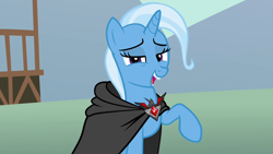 Size: 1280x720 | Tagged: safe, derpibooru import, screencap, trixie, pony, magic duel, alicorn amulet, cape, clothes, solo