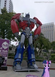 Size: 445x621 | Tagged: safe, derpibooru import, twilight sparkle, pony, irl, optimus prime, photo, ponies in real life, san diego comic con, the hub, transformers, vector