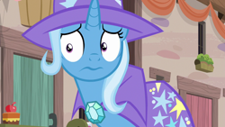 Size: 1280x720 | Tagged: safe, derpibooru import, screencap, trixie, pony, unicorn, to where and back again, cape, clothes, hat, solo, trixie's cape, trixie's hat, worried