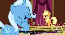 Size: 639x350 | Tagged: safe, derpibooru import, screencap, applejack, trixie, earth pony, pony, magic duel, apple, microphone, wtf, youtube caption