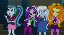 Size: 1280x714 | Tagged: safe, derpibooru import, screencap, adagio dazzle, aria blaze, sonata dusk, trixie, equestria girls, rainbow rocks, bracelet, clothes, evil grin, fall formal outfits, fingerless gloves, gem, gloves, grin, hand on hip, hand on shoulder, jewelry, necktie, pendant, siren gem, smiling, spikes, the dazzlings