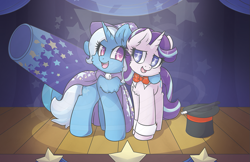 Size: 1277x830 | Tagged: safe, artist:sapphfyr, derpibooru import, starlight glimmer, trixie, pony, unicorn, assistant, cannon, chest fluff, female, hat, hug, looking at each other, mare, spotlight, stage, top hat, wand