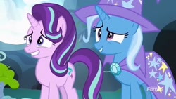 Size: 1280x720 | Tagged: safe, derpibooru import, screencap, starlight glimmer, trixie, pony, to change a changeling, spoiler:s07, awkward, cape, clothes, friendship, hat, smiling, trixie's cape, trixie's hat