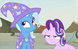 Size: 783x498 | Tagged: safe, derpibooru import, screencap, starlight glimmer, trixie, pony, to change a changeling, cape, clothes, cropped, discovery family logo, floppy ears, starlight is not amused, trixie's cape, unamused