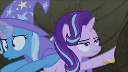 Size: 915x515 | Tagged: safe, derpibooru import, screencap, starlight glimmer, trixie, pony, to change a changeling, bagged, cape, clothes, discovery family logo, starlight is not amused, trixie's cape, unamused