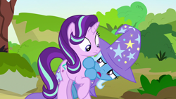 Size: 1280x720 | Tagged: safe, derpibooru import, screencap, starlight glimmer, trixie, pony, to change a changeling, clothes, cute, hat, hiding, trixie's hat