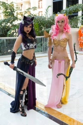 Size: 640x960 | Tagged: safe, artist:chubearcosplay, artist:lizbrickleycosplay, fluttershy, princess luna, human, 2015, armor, belly button, bow (weapon), cleavage, cosplay, female, irl, irl human, loincloth, midriff, my little pony princess warriors, photo, sword, toes, unconvincing armor, weapon, wondercon