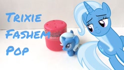 Size: 1280x720 | Tagged: safe, derpibooru import, trixie, pony, unicorn, blue coat, fashem pop, female, horn, mare, solo, toy, two toned mane