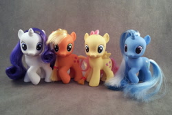 Size: 1024x685 | Tagged: safe, derpibooru import, applejack, fluttershy, rarity, trixie, earth pony, pegasus, pony, unicorn, toy